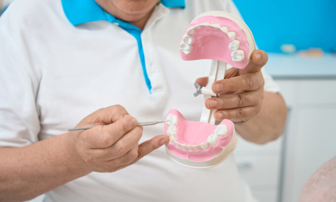 orthodontist-with-artificial-jaw-working-in-his-de-2024-10-18-09-31-40-utc (1)